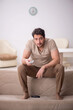 © Elnur - Young man watching tv at home