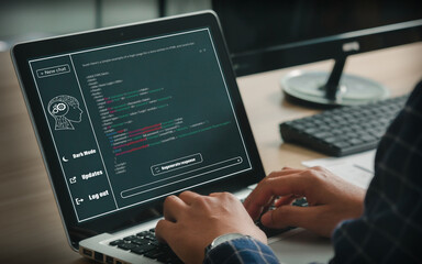 Young businessman coding a program using smart AI or Artificial Intelligence or Chatbot, artificial intelligence developed to be smart and interactive like a human.  in helping to write the program