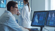 © Acronym - Professional medical doctors are maksing computer research in hospital office. Medicine, healthcare and cardiology concepts.