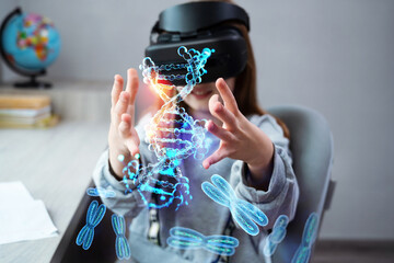 Wall Mural - schoolgirl is using virtual reality simulator headset for study. child is wearing virtual reality gl