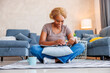 © Impact Photography - Woman reading a magazine and drinking coffee