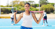 Indian girl, hockey team athlete and portrait of a sport player on outdoor field. Happy person, smile and and sun with a sports female ready for game training, exercise and fitness with happiness