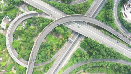 Wall Mural - 13 Oct 2019 Aerial drone view of roundabout in the city. Cars and trucks moving fast