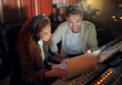 © N Felix/peopleimages.com - Collaboration, teamwork or music recording with sound headphones, laptop or composition app in edm studio. Musician, friends or happy people on technology in night radio, audio or dj media production