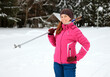 © sanek70974 - a woman with skis in winter