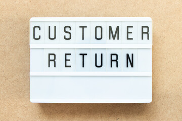 Wall Mural - Lightbox with word customer return on wood background