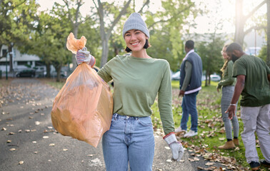 Wall Mural - Plastic bag, park and happy woman in cleaning portrait for earth day, community service or volunteering support. Recycle, trash or garbage goals of ngo person helping in nature or forest pollution