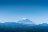 Fototapeta  - Mount Fuji mountain, Japan snow capped with clear blue sky.