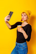 © Impact Photography - Woman drinking coffee and taking a selfie