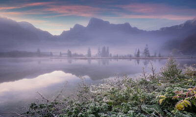 Aufkleber - Fabulous misty morning scene of nature. View of Forest lake, Almsee lake in highland with rocky peak on background. Stunning wild nature during sunrise. Amazing natural summer scenery Creative image.