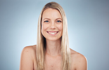 Portrait, beauty and skincare with a model woman in studio on a gray background for natural treatment. Face, skin and cosmetics with an attractive young female posing to promote antiaging or wellness