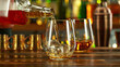 © Jag_cz - Detail of pouring whiskey into glass with ice.