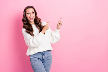 Canvas Print - Photo of astonished pretty lady toothy smile direct fingers empty space proposition isolated on pink color background