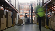 Time-Lapse: Retail Warehouse Full Of Shelves With Goods In Cardboard Boxes, Workers Scan And Sort Packages, Move Inventory With Pallet Trucks And Forklifts. Product Distribution Logistics Center