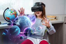 Child Girl Wearing Virtual Reality Headset And Looking At Digital Space System With Planets Or Universes. Future Learning And Education