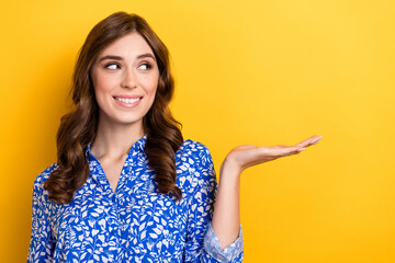 Photo of stunning positive lady arm presenting empty space cool offer proposition isolated on yellow color background