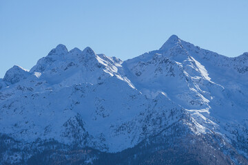 Sticker - The Valtellina mountains, with its pastures, woods and fresh snow, during a wonderful winter day near the village of Sondrio, Italy - January 2023.