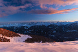 Fototapeta Most - Sunset over the Italian alps of Valtellina, near the village of Sondrio, Italy, with fresh snow and a spectacular view of the woods and peaks - January 2023
