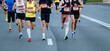 © sports photos - group of male runners run city race