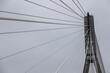 pylon of the suspension bridge over the Vistula river in Warsaw with ropes supporting the roadway