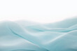 Wavy surface of a pastel blue chiffon fabric as a background with copy space. Photo in perspective