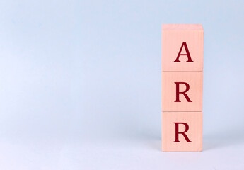 Wall Mural - ARR on wooden cubes on a blue background