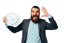 Shocked Young Bearded Man Screams Load While Holding A Round White Clock.