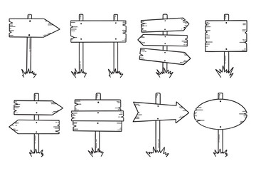 Wooden road signs doodle set. Wooden direction signs and arrows in sketch style.  Hand drawn vector illustration isolated on white background.