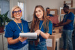© Zamrznuti tonovi - Portrait of a two woman volunteer working in a charity donation center