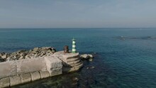 Aerial Footage Of The Lighthouse At The Pier Of The Ancient And Amazing Jaffa Port In Israel.