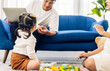 © Art_Photo - Portrait of enjoy happy love asian family father and mother with little asian girl smiling activity learn and skill brain training play with toy build wooden blocks board education game at home