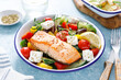 © Sea Wave - Greek salad with grilled salmon fish. Traditional mediterranean cuisine. Healthy food, diet