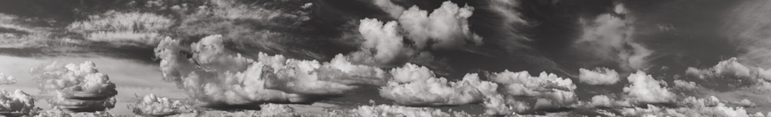 Poster - Panorama Of Cloudy Sky. Natural Day Cloudy Sky Abstract Background. Panorama Panoramic View. Backdrop. Copy Space. Black And White Colors.