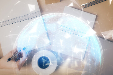 Aufkleber - International business hologram over hands taking notes background. Concept of success. Multi exposure