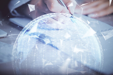 Aufkleber - International business hologram over hands taking notes background. Concept of success. Multi exposure
