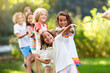 © famveldman - Kids play tug of war. Children pull rope.