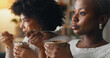 Relax, ice cream and women friends eating together on the weekend to bond with frozen dairy treats. Black people in girl friendship enjoy sweet dessert break to relax while resting in home.
