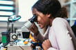 © Mediteraneo - Smart Young African American Schoolgirl is Studying Electronics in Her Science Hobby Robotics Project. Girl is Working on a Robot in Her Room. Education Concept.