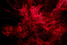 Red Black Abstract Ocean Background. Splashes And Waves Of Paint Under Water, Clouds Of Smoke In Motion