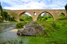 Historical Bridge With Stream And Blue Sky In Turkey