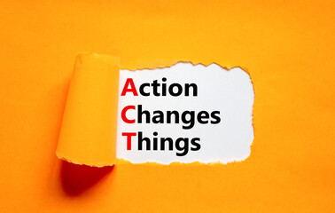 Wall Mural - ACT action changes things symbol. Concept words ACT action changes things on white paper on a beautiful orange background. Business and ACT action changes things concept. Copy space.