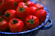 © Cavan Images - A close up view of cherry Tomatoes in a colander.