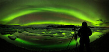 Photographer Witnessing The Aurora Borealis Over Jkulsrlun Glacier Lagoon, Iceland