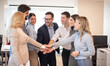 © Bojan - Business team showing unity with their hands together