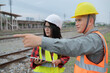 © reewungjunerr - Two engineer working at train station,Work together happily,Help each other analyze the problem,Consult about development guidelines