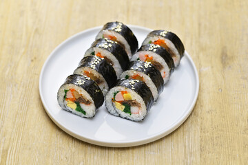 Wall Mural - Gimbap is a Korean food consisting of rice and several ingredients seasoned with sesame oil and wrapped in nori seaweed.