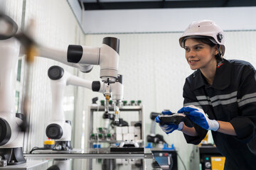 Wall Mural - Female engineer control autonomous mobile robot or AMR in the laboratory room. Woman engineer training or maintenance AI robot