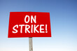 On strike, sign with slogan