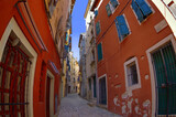 Fototapeta Uliczki - Streets of Rovinj with calm, colorful building facades, Istria, Rovinj is a tourist destination on Adriatic coast of Croatia