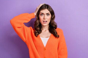 Poster - Photo of anxious embarrassed lady wear orange clothes arm head impressed bad news isolated on purple color background